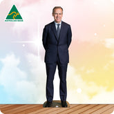 Man in a suit standing on a wooden platform with a colorful background and Australian Made logo.